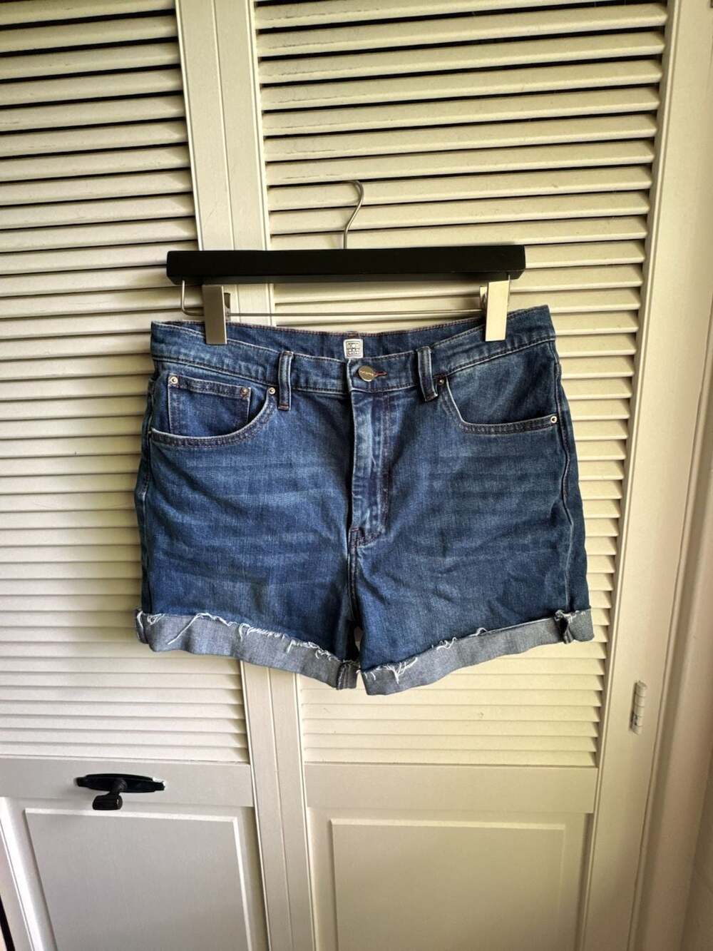 Totême High-Rise Denim Shorts in Dark Wash with Rolled Hem